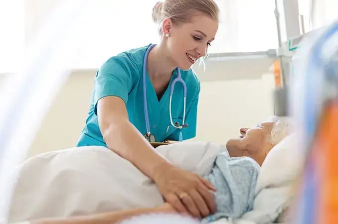 Long Term Care nurse at the bed side of an elderly patient Long Term Care nurse at the bed side of an elderly patient