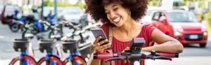 young woman on a scooter in the city