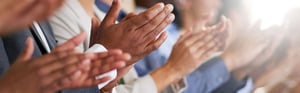 a group of hands claping